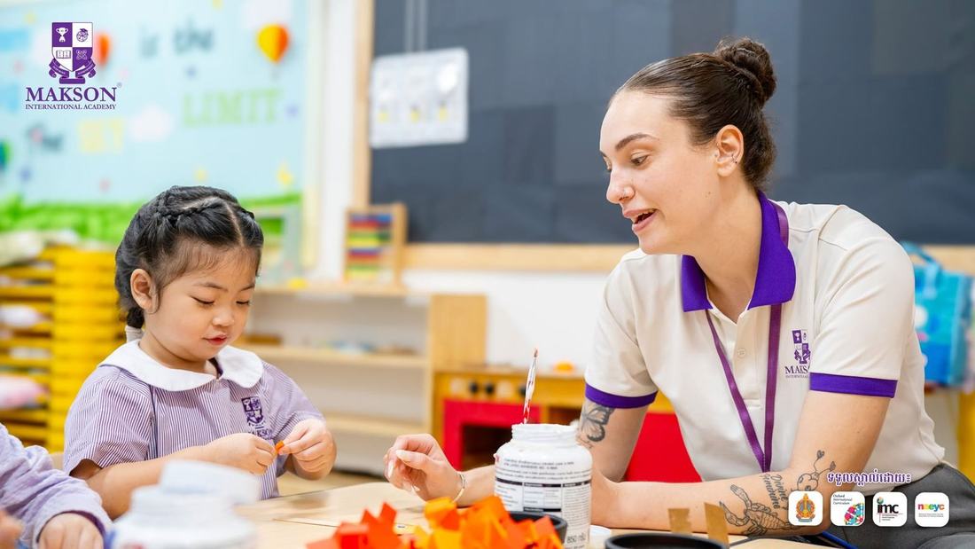 A teacher using modern classroom tools with a student